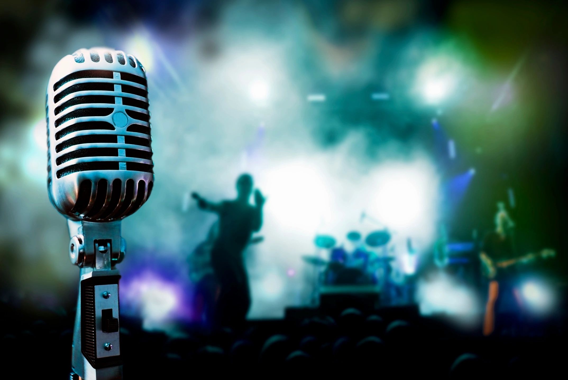Vintage microphone with concert background