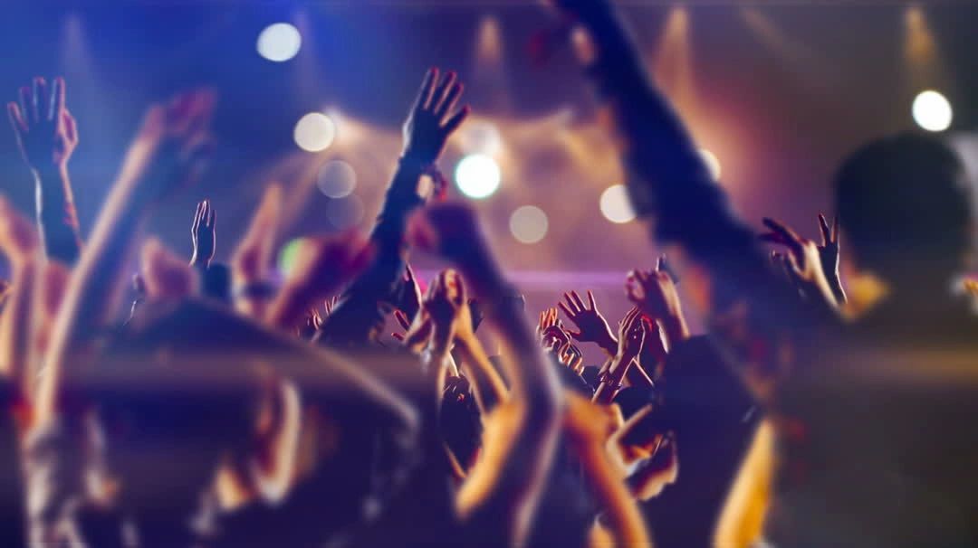 Concert crowd with golden lights